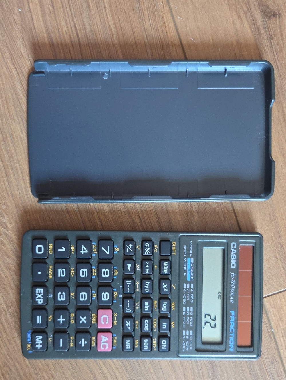 Casio scientific calculator in black with red accent